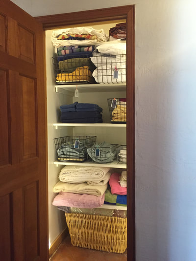 Linen closet lit and organized